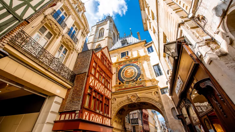 Street view with the Gros Horloge astronomical clock in Rouen city, France