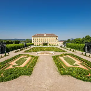 Schloss Schonbrunn Kronprinzengarten - manicured gardens in front of a grand house, Vienne, Austria