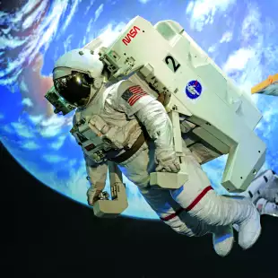 Floating astronaut in a white space suit with the earth behind them