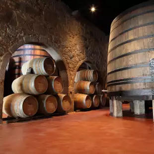 Old fashioned Porto wine cellar with wooden barrels in Porto, Portugal