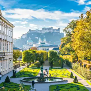 Beautiful view of famous Mirabell Gardens with the old historic Fortress Hohensalzburg in the background in Salzburg, Austria