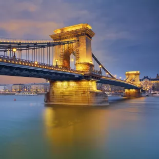 View of Chain Bridge and Budapest illuminated at twilight in Hungary