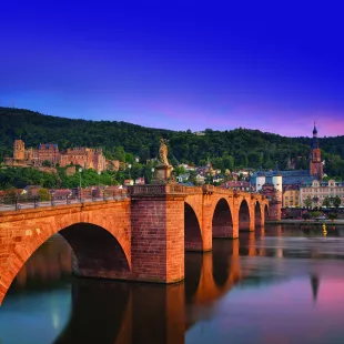 The old bridge in Heidelberg city and colourful evening sky in Germany