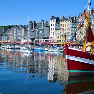 Old Harbour of Honfleur, France, featuring colourful fishing boats