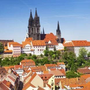 Famous Castle, Albrechtsburg, amongst white houses with orange roofs in in Meissen, Saxony, Germany.