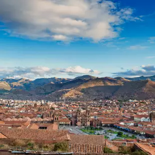 Aerial view of Cusco Main Square, Peru, with a background of the Peruvian Andes