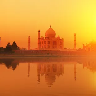 Taj Mahal at dusk with beautiful orange sky in India