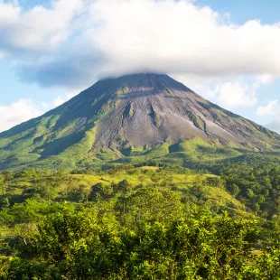 View of Arenal Volcano surrounded by rainforest in Costa Rica