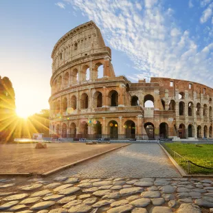 Colosseum in Rome lit by morning sunlight, Italy