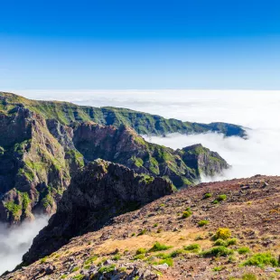 Landscape around Pico do Arieiro with mist amidst the mountains in Madeira Island, Portugal