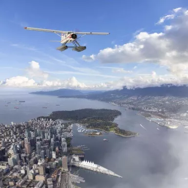 A seaplane flies over Vancouver, Canada