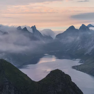 Scenic view of Fjord with mist in Norway during Summer