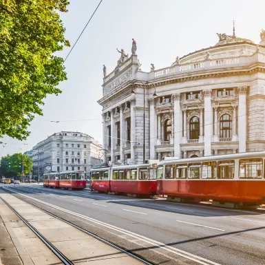 Wiener Ringstrasse with Burgtheater and tram at sunrise, Vienna, Austria