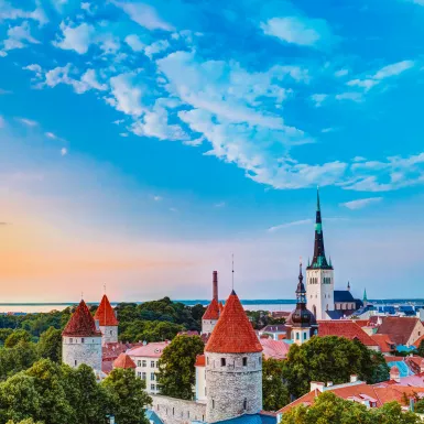 Toompea Castle before sunset, featuring surrounding treelines, Estonia