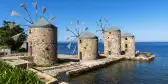 Famous stone windmills of Chios island overlooking the sea in Greece