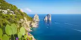 Famous Faraglioni rocks on the coast of Capri island in Italy