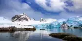 Mountains, snow and blue glacial ice in Svalbard 