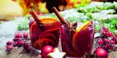 Two decorated glasses of mulled wine at German Christmas market stall