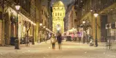 Illuminated cityscape of Zrinyi Street on a snowy winter day in Budapest