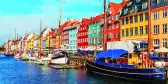 Nyhavn pier with colourful buildings, ships, yachts and other boats in the Old Town of Copenhagen, Denmark.