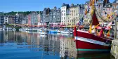 Old Harbour of Honfleur, France, featuring colourful fishing boats