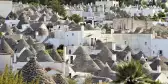 View over the cone-roofed Trulli huts in Alberobello, Italy