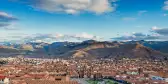 Aerial view of Cusco Main Square, Peru, with a background of the Peruvian Andes