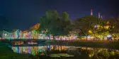 Colourful lights in siem reap overlooking the water, cambodia.