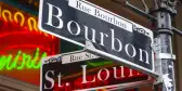 Street sign from in New Orleans, that is focused on the text saying Bourbon