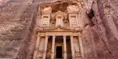 Front view of the Treasury, an elaborate carved sandstone temple in the side of a rock face, Jordan