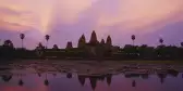 A distant view of Angkor Wat, a temple complex in Cambodia, at twilight