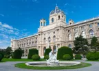 Fountain with sculptures and the Natural History Museum in Vienna, Austria