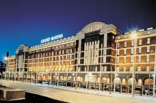 Exterior of Scandic Grand Marina under a clear evening sky