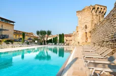 Outdoor pool and sun loungers at the Aquabella Hotel and Spa in France