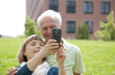 Senior couple posing for self-portrait with mobile phone