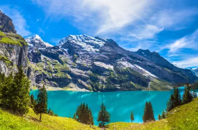 Summer view over Oeschinen lake and the alps