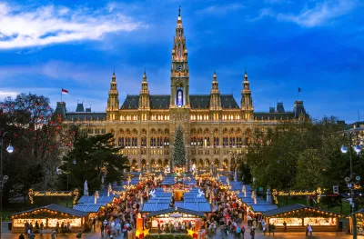 Traditional Christmas market at Vienna Town Hall at night in front of town hall