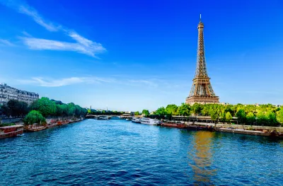 View of the Eiffel Tower and river Seine on a sunny day in Paris, France