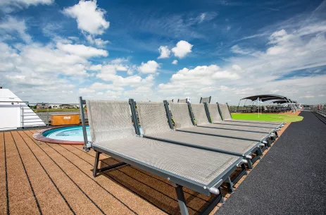 Sundeck of the BW Oscar Wilde with view of it's grey loungers and Jaquzzi