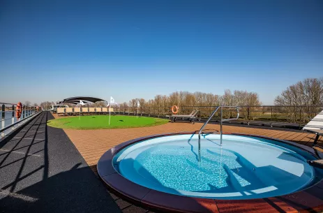 Small outdoor pool and golf putting green aboard the George Eliot ship