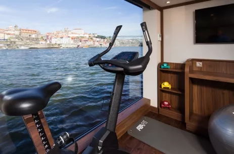 Gym with window view aboard the Douro Elegance ship