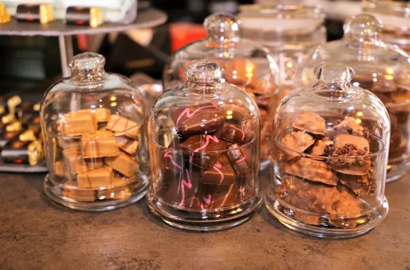 Variety of handcrafted chocolates and truffles in glass jars