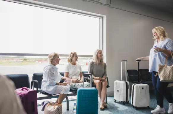 4 women meeting up at the airport