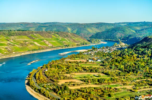 The great loop of the Rhine at Boppard in Germany, bright blue waters and hills in the distance.