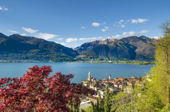 View of Lake Maggiore and village of Vira with mountain in the distance