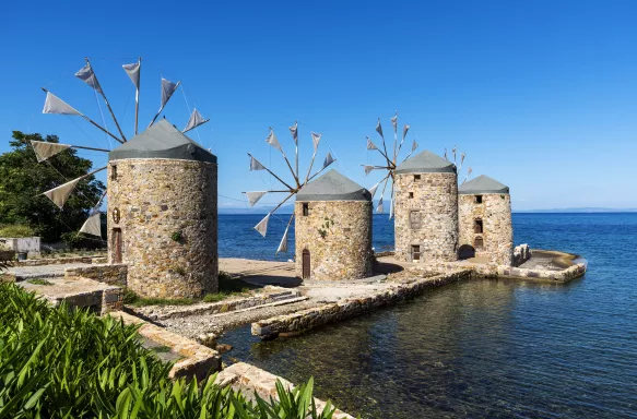 Famous stone windmills of Chios island overlooking the sea in Greece