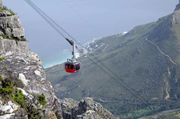 Red and black cable cart ascending at Table Mountain, Cape Town