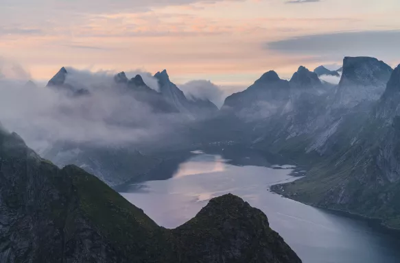 Scenic view of Fjord with mist in Norway during Summer