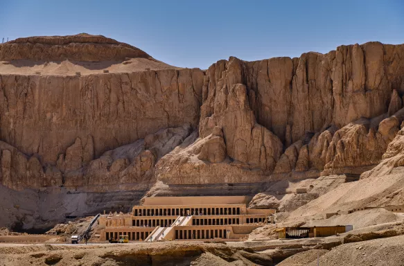 Sandstone temple at the foot of a desert cliff, Egypt 