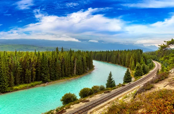 Railway line along Bow river at Banff National Park in Canada